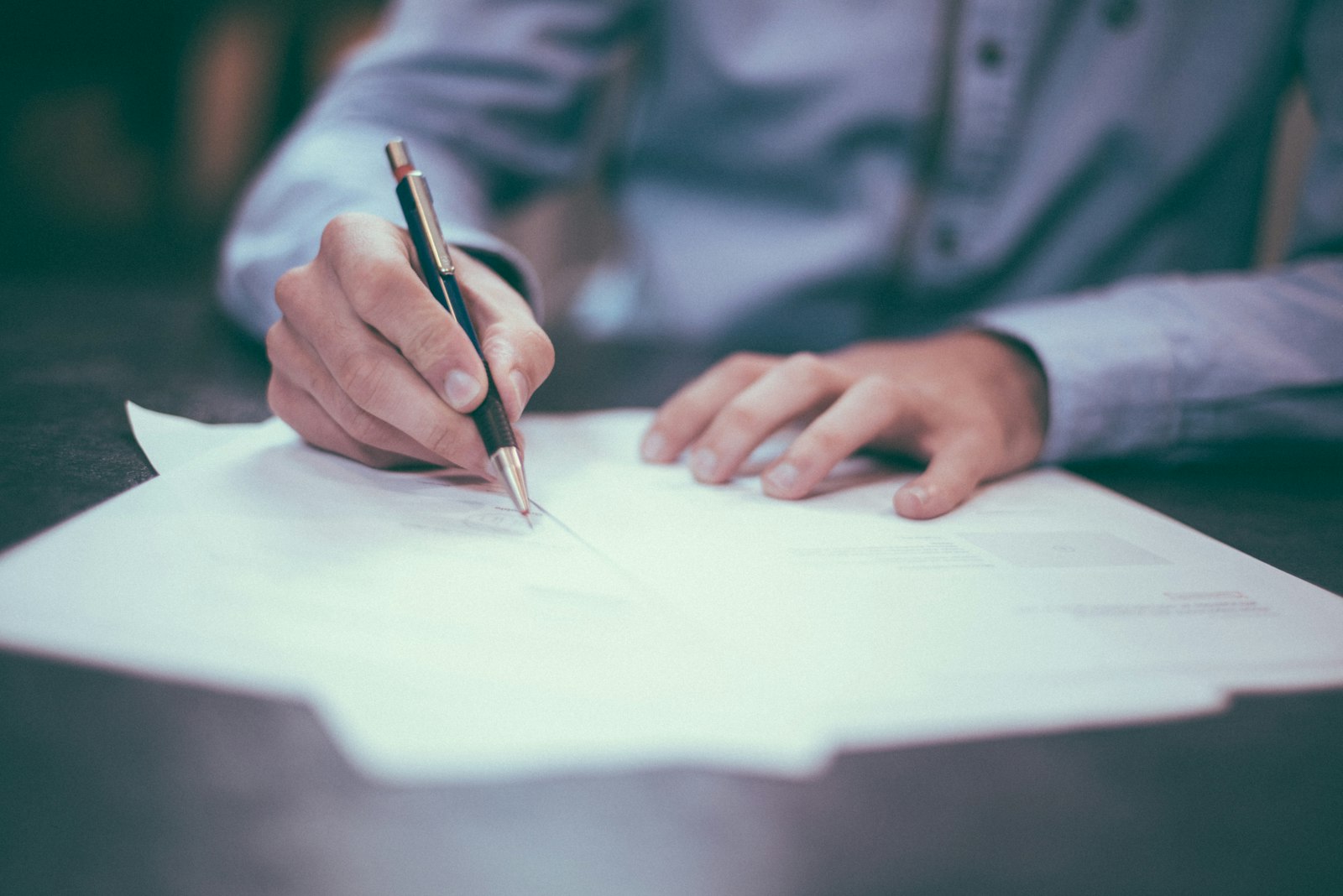 Clients reviewing closing documents with a title professional